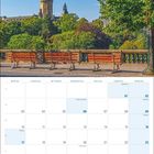 Kalender für Mai 2027 mit Feiertagen wie Christi Himmelfahrt und Pfingsten. Oben: Bank vor historischem Turm im Park.
