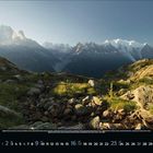 Kalenderblatt für Mai 2011. Bild: Berglandschaft mit schneebedeckten Gipfeln im Hintergrund, steiniger Pfad im Vordergrund.