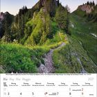Mai 2027 Kalender mit Alpenpanorama, Kreuz auf Berggipfel und umgeben von grünen Bäumen und Wiesen.