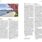 Texte, die im Bild vorkommen:

- "Nordstadt"
- "Konrad-Adenauer-Ufer"
- "Kirche St. Kunibert"
- "Zoo und Aquarium"

Das Bild zeigt einen blühenden Baum am Flussufer.