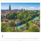 Kalender mit Bild der Stadt Bern. Fluss und grüne Bäume, dahinter historische Gebäude und Kirchtürme. Monat Mai.