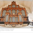 Kirche Saint-Martin in Kintzheim, Frankreich. Große, kunstvoll verzierte Orgel mit Holzdetails und Pfeifen in einer Kirche.