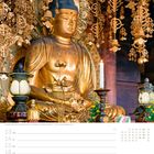 50. Woche Dezember. Buddha-Statue, reich verziert mit goldenen Ornamenten, friedlicher Ausdruck, Kerzenlicht, Kalendertext.
