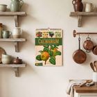 Der Text "Ackermanns illustriertes Culinarium" ziert ein Kalenderblatt mit botanischer Illustration. Umgebung: rustikale Küche.