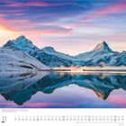 Bachalpsee mit Jungfrau, Finsteraarhorn und Schreckhorn, Schweiz. Im Vordergrund ein klarer See, im Hintergrund schneebedeckte Berge.