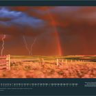 Im unteren Bereich steht "NOVEMBER" mit einem Kalendarium. Zu sehen ist eine Gewitterlandschaft mit Blitzen und Regenbogen.