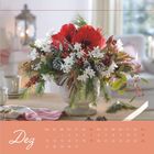Text: "Dez". Darunter ein Kalender für Dezember. Darauf ein Blumenarrangement mit roten und weißen Blüten.