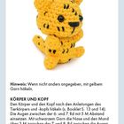 Text: Leopard. Hinweis: Gelbes Garn. Körper und Kopf: Anleitung folgen. Häkelarbeit. Gelber gehäkelter Leopard mit schwarzen Flecken.