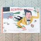 Text: "ACHOOOOOOO! Mr. Stricter flew out like a snot rocket. He shook Bruno’s slime from his ears. 'Good news,' he said. 'I found the missing homework.'"

Illustration: Ein Mann im gelben Pullover wird von einem Niesen weggeschleudert.