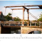 Text: "Zugbrücke", "CASARES EDITION", Datum zeigt 6. Es ist eine Zugbrücke über einem Fluss mit umgebenden Gebäuden und Bäumen.