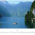 Text: "Deutschland, Königssee" und Zahlen 1 bis 30, darunter "6". 

Beschreibung: Ein See mit Boot, umgeben von Bergen und Wäldern.