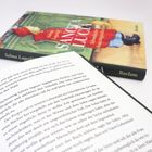 Buchumschlag: "Selma Lagerlöf - Sankt Lucia". Geöffnetes Buch mit deutschem Text.