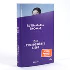 Buchtitel: "Die zweitgrößte Liebe" von Ruth-Maria Thomas. Oben schaut eine Frau hinter einem lila Buchcover hervor.