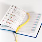 Offener Kalender zeigt Woche ab 18. Januar 2027, mit Symbolen und Notizen. Gelbes Leseband, rechte Seite tabellarisch.