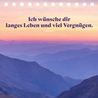 "Ich wünsche dir langes Leben und viel Vergnügen. Novalis." Im Hintergrund ist eine Landschaft bei Sonnenuntergang.