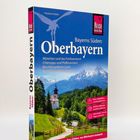 "Bayerns Süden: Oberbayern. Unterwegs mit REISE Know-How." Ein Reiseführer mit Alpenlandschaft und Kirche im Vordergrund.