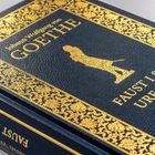 Buchcover in Blau und Gold. Text: "Johann Wolfgang von Goethe, Faust I & II, Urfaust". Goldene Verzierungen und Figur.