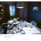 Texte im Bild: "Lucy Li and Florian Semlitsch, Illegal Rain, 2017-18."

Beschreibung: Technikraum mit Prototypen auf einem Tisch und Werkzeugen, ein Fenster im Hintergrund.