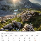 Kalendarium für Juni 2027 unten. Oben Bild einer Berglandschaft bei Sonnenaufgang mit dramatischem Licht und Felsen im Vordergrund.