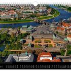 "Juni" und Kalendertage. Luftaufnahme einer Stadt mit Fluss, Brücken, historischen Gebäuden und Grünflächen.