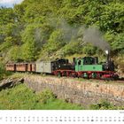 Schmalspurlokomotive der Gattung IV K. Kalender für Juni. Dampflokomotive fährt durch grüne Landschaft.