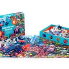 "Abenteuer Ozean" steht auf einer Puzzle-Schachtel mit buntem Meeresmotiv. Ein fertiges Puzzle und lose Teile sind sichtbar.