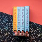 "TO THE STARS AND BACK, VOLUME ONE und VOLUME TWO, LB INK." Buchrücken in Orange und Hellblau, darunter Illustrationen.