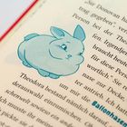 Textpassagen beinhalten: "Theodora" und "Ballonhasen". Daneben eine Illustration eines blauen, lächelnden Hasen.