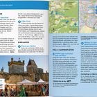 "ERLEBE LOS!" zeigt Reiseführer mit Kartenabdeckung Frankreichs. Verschiedene Buchcover unten.