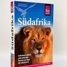 „Südafrika“ steht groß, darunter ein Löwenkopf. Text: „Individuell erleben und entdecken – Routen und Tipps für Selbstfahrer“.
