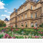 Kalenderblatt mit "JUL" und Datumsleiste unten. Historisches Gebäude mit Garten voller bunter Blumen.