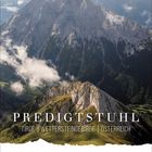 Text: "PREDIGTSTUHL, TIROL, WETTERSTEINGEBIRGE, ÖSTERREICH". 

Berglandschaft mit markantem Gipfel und Wolken.