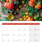 Kalenderblatt für Juli 2027. Oberhalb sind bunte Tomaten und ein Glas Öl arrangiert.