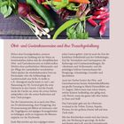 "Obst- und Gartenbauvereine und ihre Brauchgestaltung." Korb mit frischem Gemüse: Karotten, Zucchini, Paprika auf Holztisch.