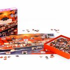 "Der Tod auf dem Nil" steht auf einer Puzzlebox. 1000 Teile, illustriert mit rot-orangefarbenem Nil, Figuren und Schiff.