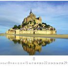 Text: "Mont Saint Michel" und "8". Das Bild zeigt die Abtei Mont Saint Michel, gespiegelt im Wasser, unter einem klaren blauen Himmel.