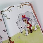 Im linken Text stehen Geschichten über Tiere. Rechts steht ein Mädchen mit lila Haaren, roter Schleife und ein großer weißer Wolf.