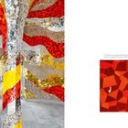 Text: "Curving mosaic bands of materials such as glass, mirrors, and gravel decorate the Room of Spirituality."  
Bunte Mosaikwände in Rot, Gelb, Silber.