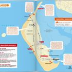 Karte von Amrum mit Highlights und Tipps wie "Strand chillen" und "Leuchtturm Amrum". Nordsee und Wege markiert.