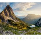 01 bis 31, Tagesnamen darunter. Eine hügelige Landschaft mit einem großen Berg und einem See im Hintergrund.