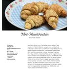 Rezept für Mini-Nusshörnchen. Foto: Mehrere Nusshörnchen auf einem weißen Teller mit Blumenmuster.