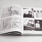 Texte: "BOY GEORGE", "Schumann's". Enthält schwarz-weiße Fotografien, darunter ein Porträt und abstrakte Bilder.