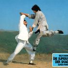 Text: "Billy Chong, Die Superfaust der Shaolin, Super-Power." Zwei Männer in Kampfkunstposen, Landschaft im Hintergrund.