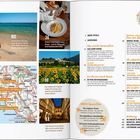 Text: "GEHT'S NOCH TYPISCHER? Das ideale Bild der Toskana..."  
Szene: Sanfte Hügel, Weinberge, Zypressen, Sonnenuntergang.