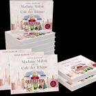 „Sophie Blanche, Madame Malou und das Café der Träume“ auf Buchcovern mit Café-Illustration im winterlichen Paris.