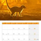 Kalenderblatt September 2027 mit Erdmännchen-Silhouette vor orangefarbenem Hintergrund. Tage und Wochenzahlen sichtbar.