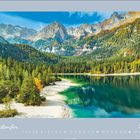 "September 2027" steht in weißer Schrift auf grauem Hintergrund unten. Oben Berge, Wald und ein türkisfarbener See.