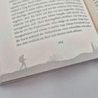 Seite 254 mit Text über einen Aufstieg. Unten links eine Illustration eines Wanderers mit Rucksack.