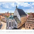 Kalenderseite September mit Bild vom Freiberger Dom St. Marien, blauer Himmel mit Wolken und umliegende historische Gebäude.