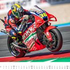 Die Zahl 36 auf einem roten Motorrad mit HONDA- und Castrol-Logos. Kalender für September unten. Rennstrecke im Hintergrund.